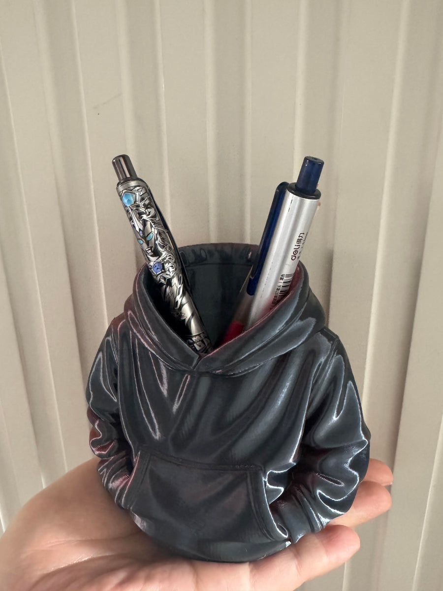 Gray hoodie-shaped pen holder with pens