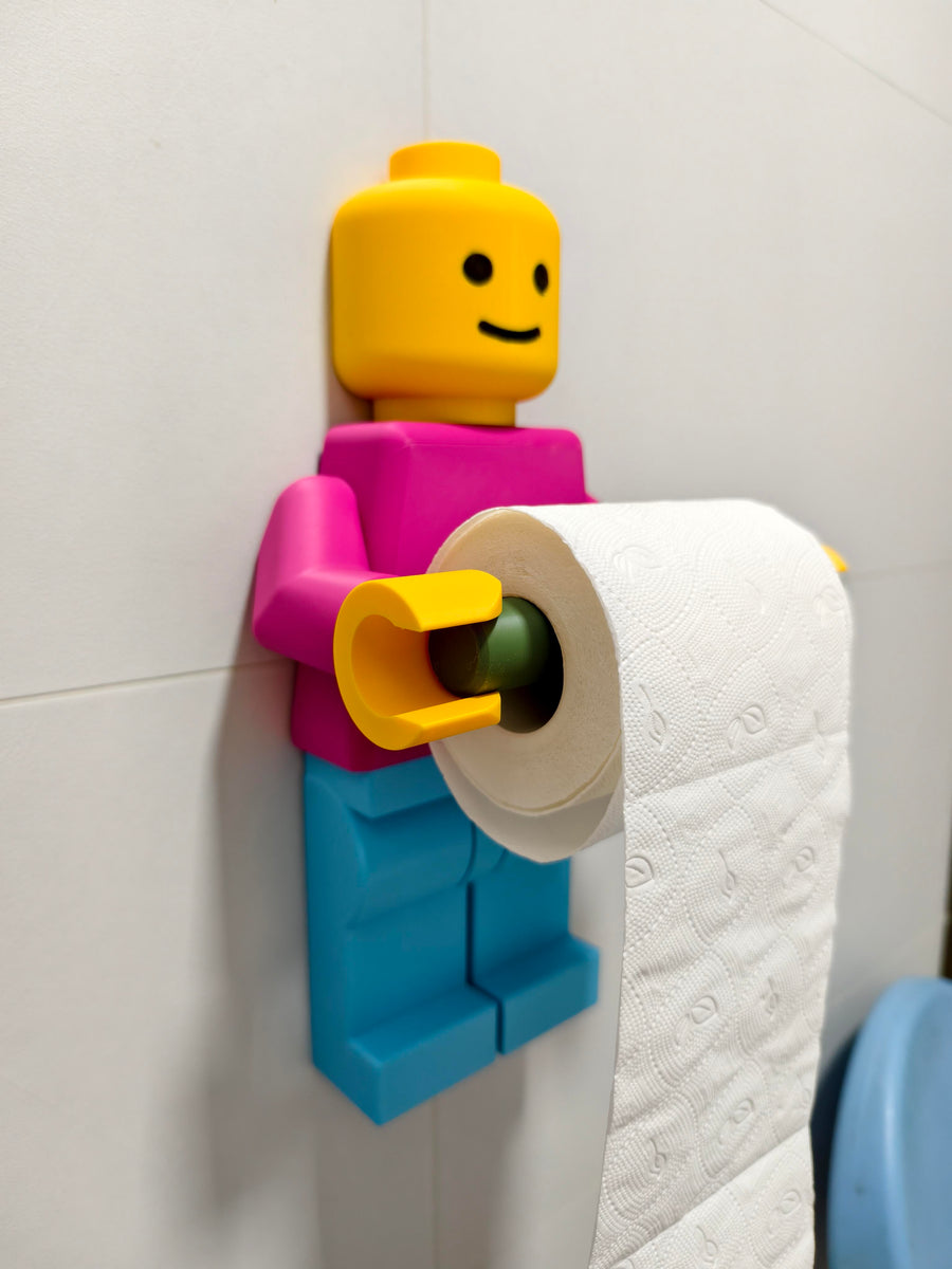 Colorful character-shaped toilet roll holder mounted on a wall